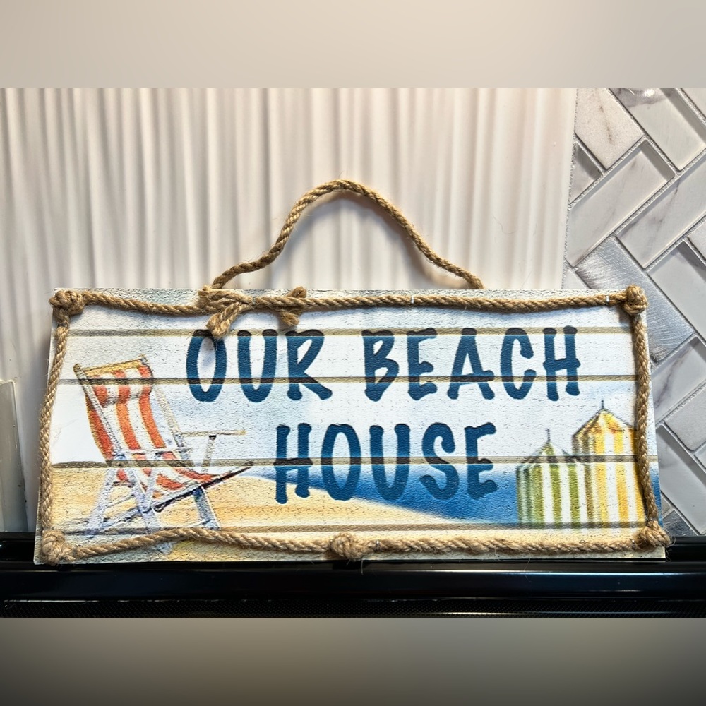 Wooden Beach House with rope sign